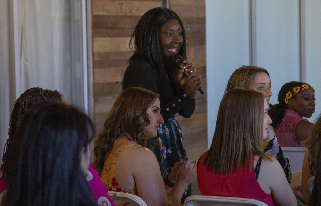 Esther Ossei Anto talks to conference goers during the Manifest Summit at Tivoli Village in Las ...