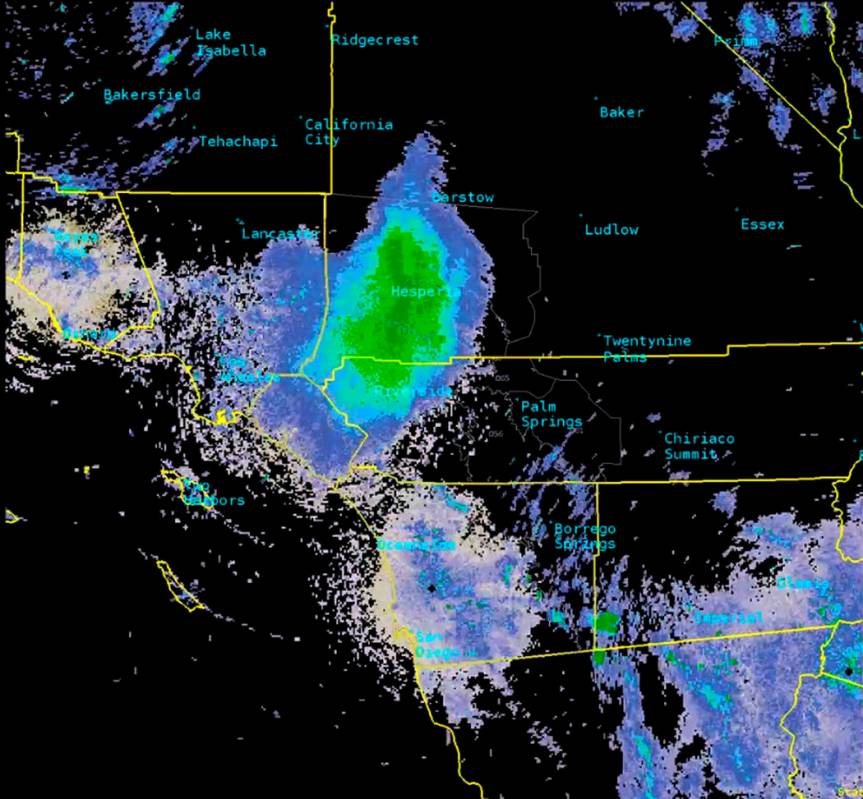 This Tuesday, June 4, 2019, image provided by National Weather Service radar shows a green mark ...