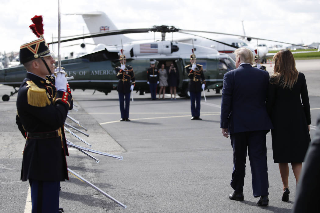 President Donald Trump, with first lady Melania Trump, arrive at Caen Airport, Thursday, June 6 ...