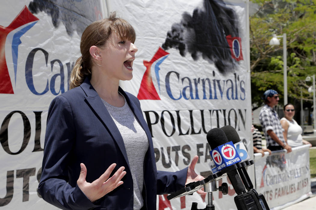 Kendra Ulrich, of Stand.earth, speaks outside of federal court, Monday, June 3, 2019, in Miami. ...