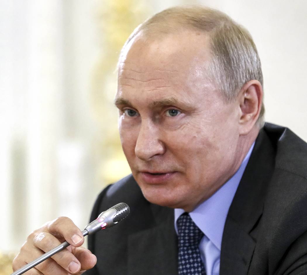 Russian President Vladimir Putin speaks during a meeting with heads of world's leading news age ...