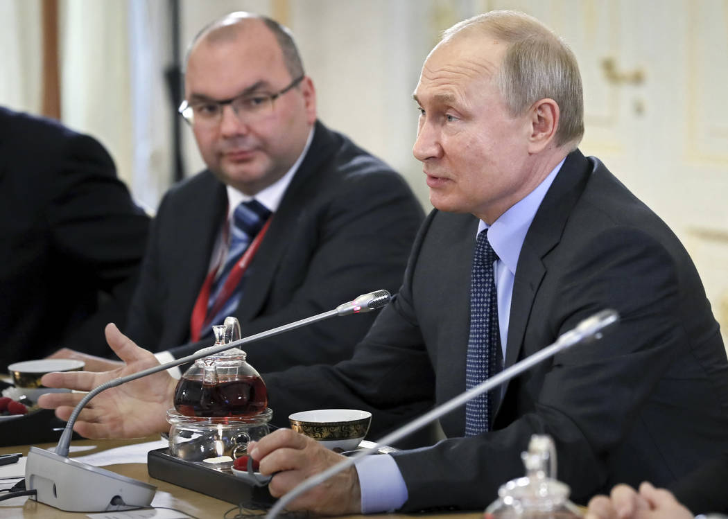 Russian President Vladimir Putin speaks during a meeting with heads of world's leading news age ...