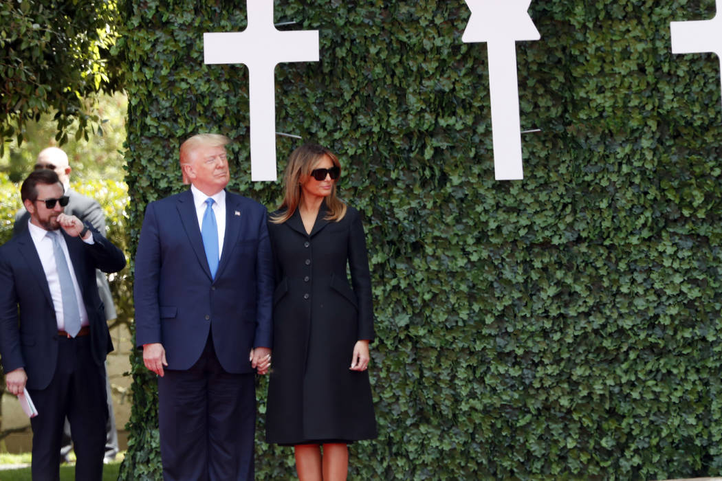 U.S. President Donald Trump and first lady Melania Trump arrive for a ceremony to mark the 75th ...