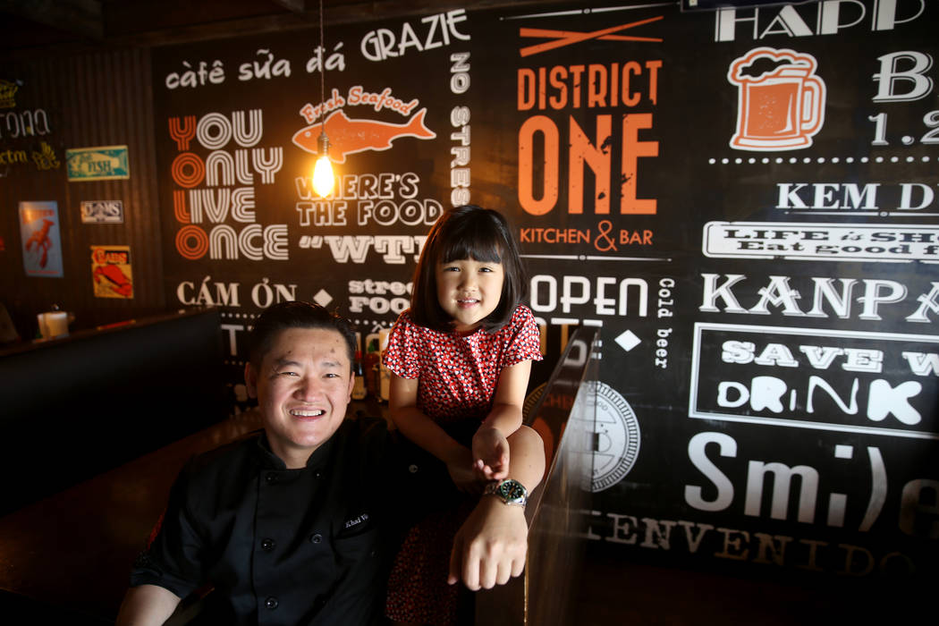 Chef Khai Vu and his daughter, Audrey, 5, at District One Kitchen & Bar in Las Vegas Monday ...