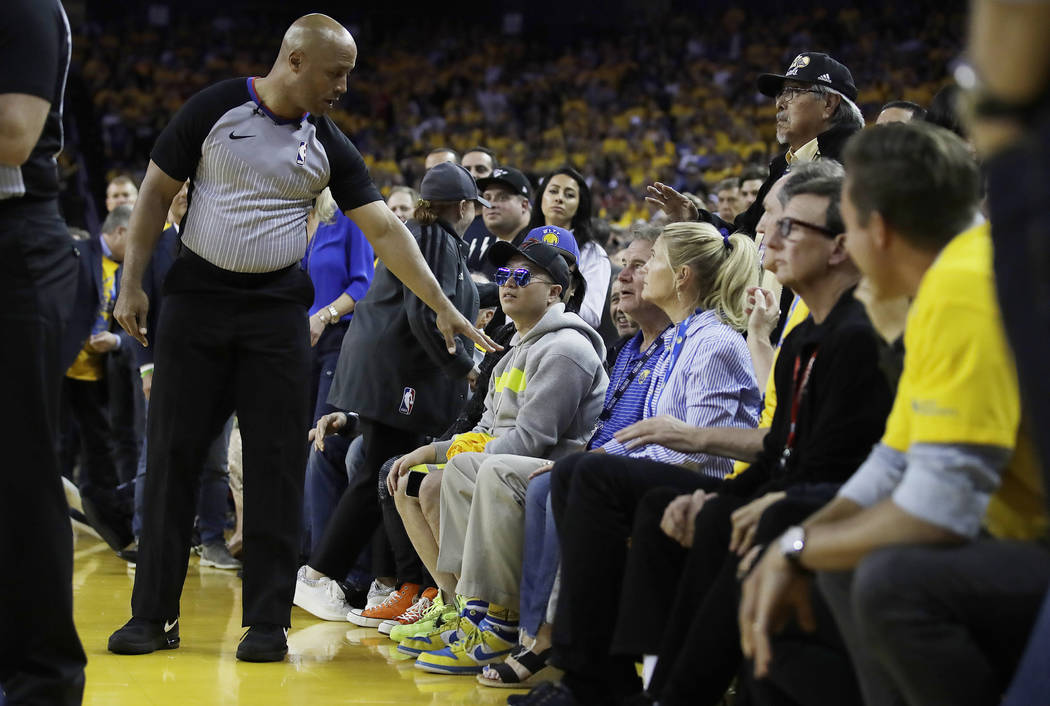 In this photo taken Wednesday, June 5, 2019, referee Marc Davis, left, gestures toward Golden S ...