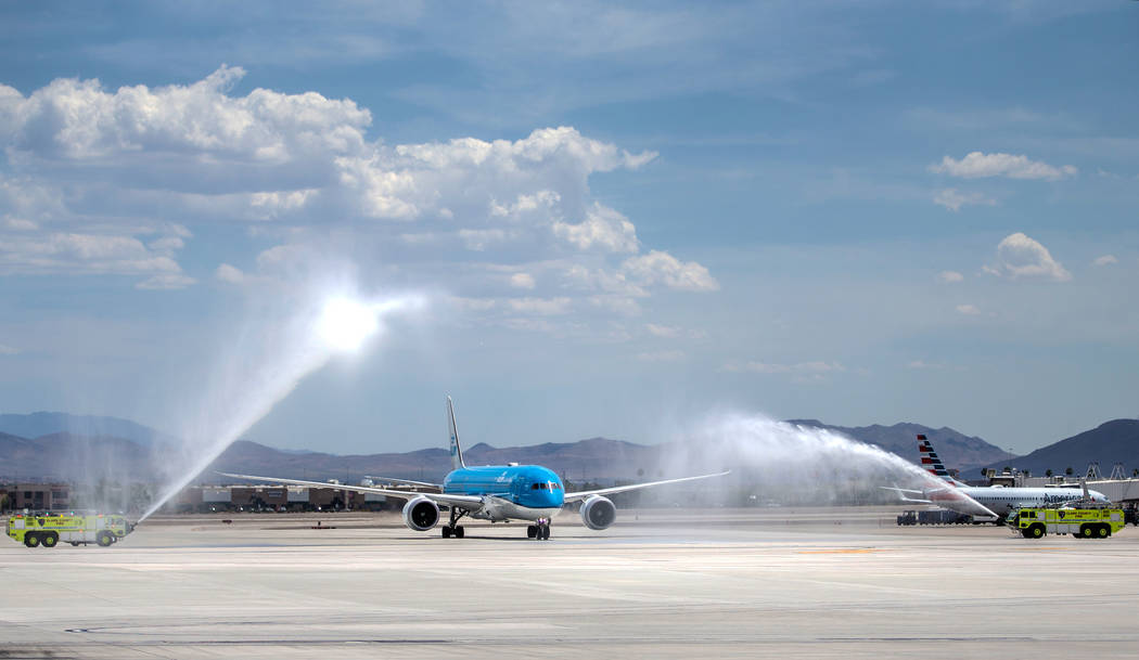 KLM Royal Dutch Airlines flight 635 taxis during a water arch ceremony after arriving at McCarr ...