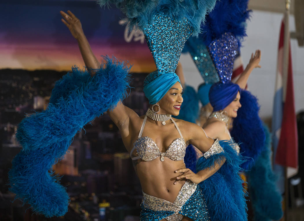 Showgirls perform during a ribbon cutting ceremony at McCarran International Airport celebratin ...