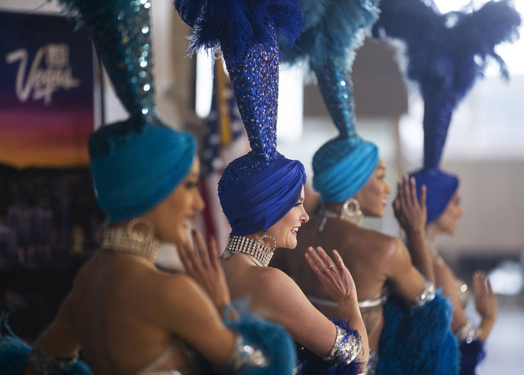 Showgirls perform during a ribbon cutting ceremony at McCarran International Airport celebratin ...