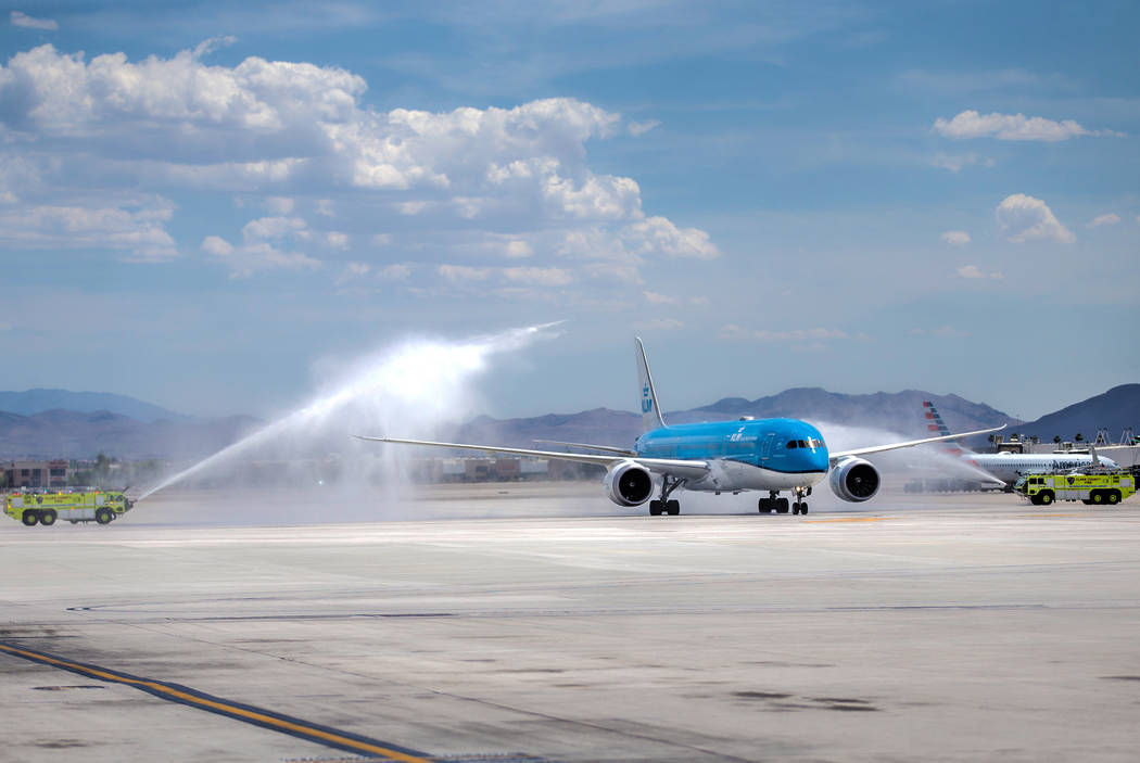 KLM Royal Dutch Airlines flight 635 taxis during a water arch ceremony after arriving at McCarr ...