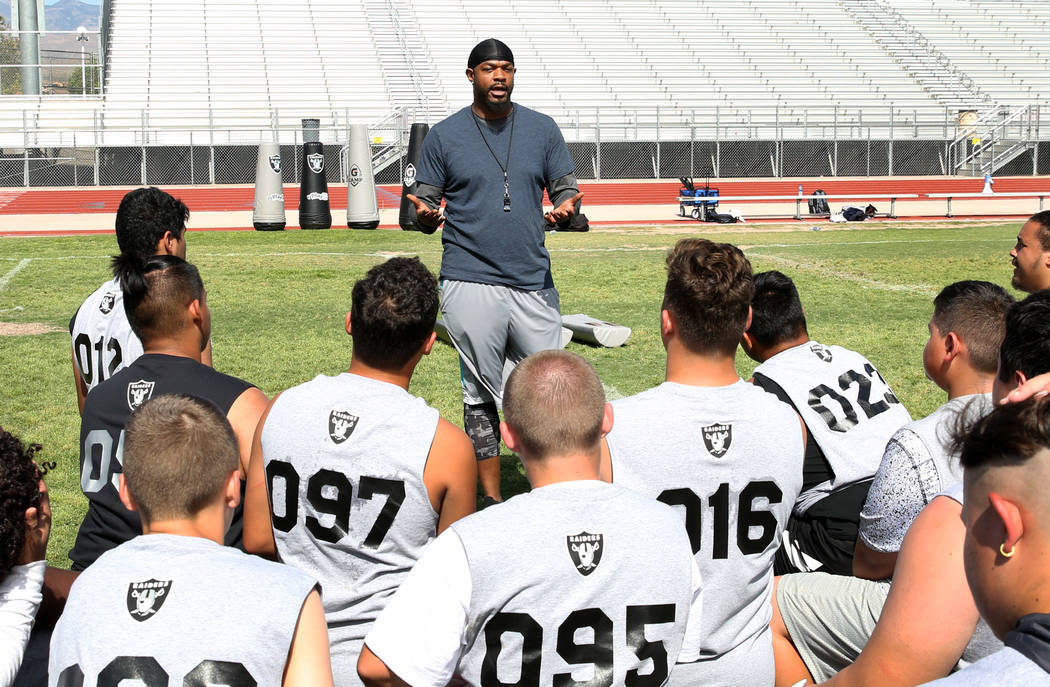 Dejuan Peterson of Freedom Classical Academy speaks to Clark County-area high school football p ...