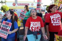 McDonald's franchise employees, including Diana Diaz, center, and Lupe Guzman, right, protest f ...