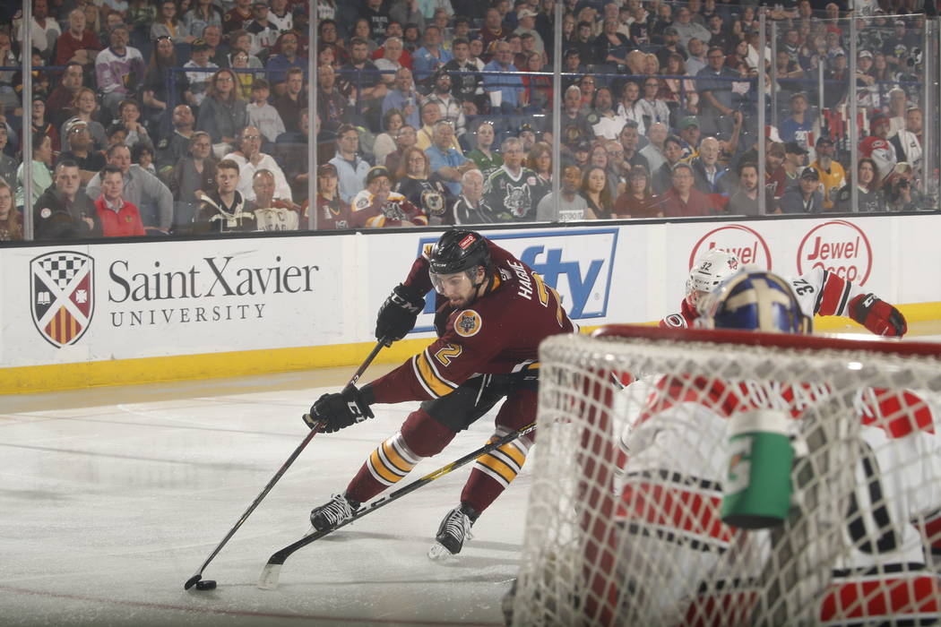 Chicago Wolves defenseman Nic Hague (2) moves toward the Charlotte Checkers goal in the first p ...