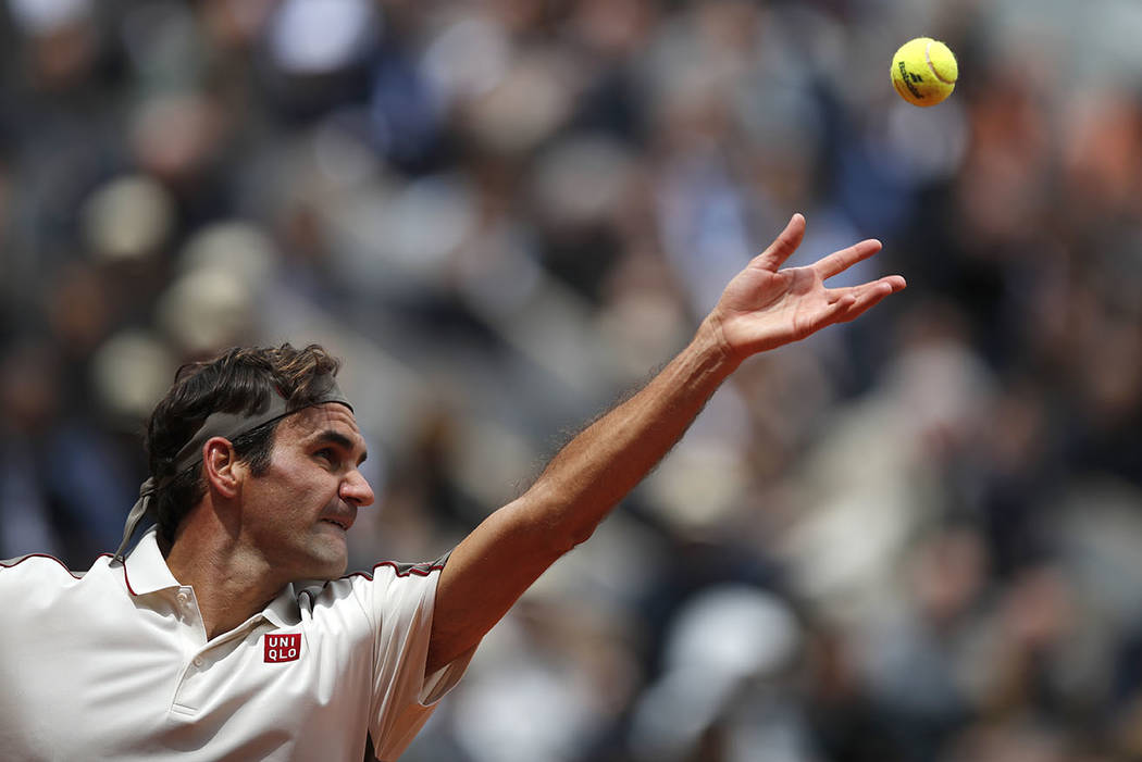 Switzerland's Roger Federer serves against Spain's Rafael Nadal during their semifinal match of ...