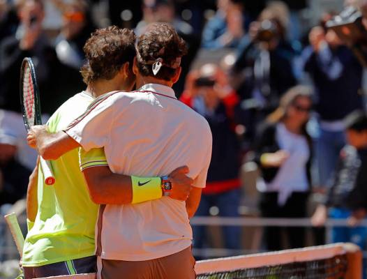 Spain's Rafael Nadal, right, is congratulated by Switzerland's Roger Federer after winning thei ...