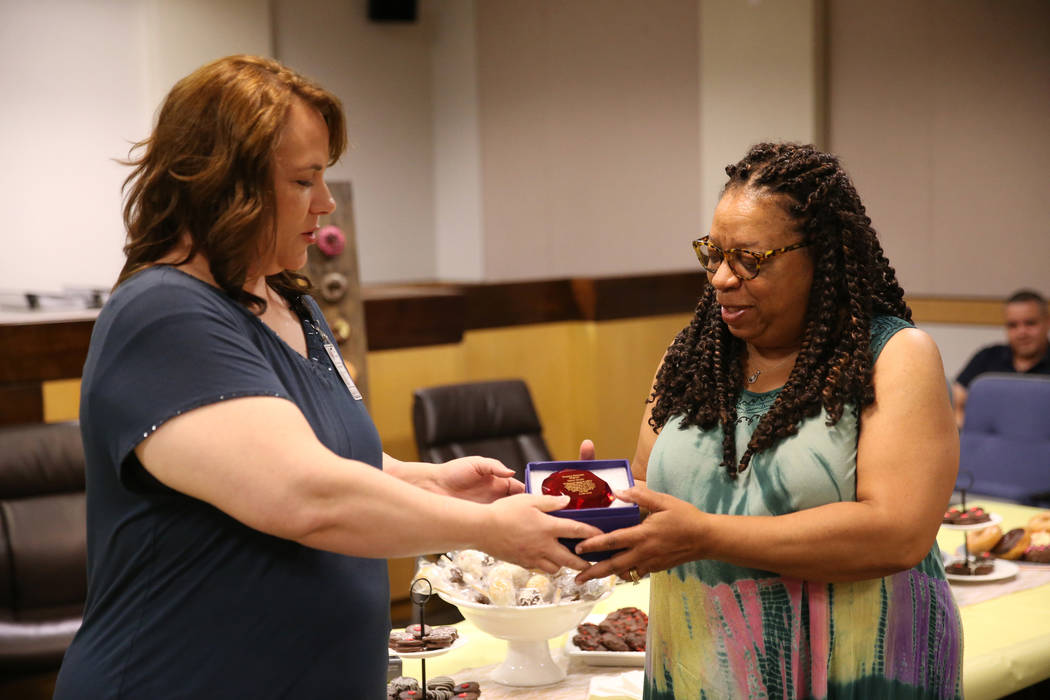 Truancy Diversion Program's Family Advocate Michelle Cutler, left, recognizes Judge Debra Harpe ...