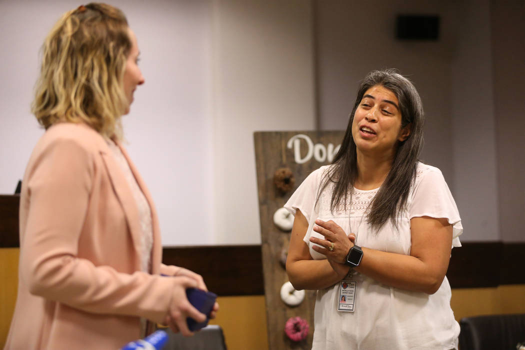 Jennifer Mtatabikwa-Walker, left, introduces Family Advocate Michelle Young, during the Truancy ...