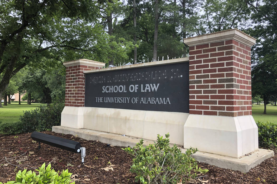 University of Alabama School of Law sign is seen after employees removed the name of donor Hugh ...