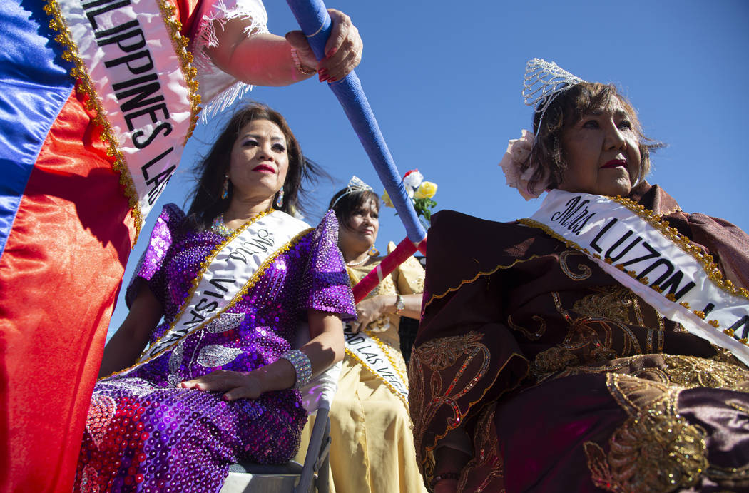 Hermia Landy, right, Vivian Locke, middle, and Padua Raman, left, wait before the fourth annual ...