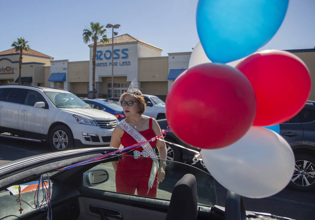 Ms. Bicolandia, choose not to give her real name, wait before the parade during the fourth annu ...