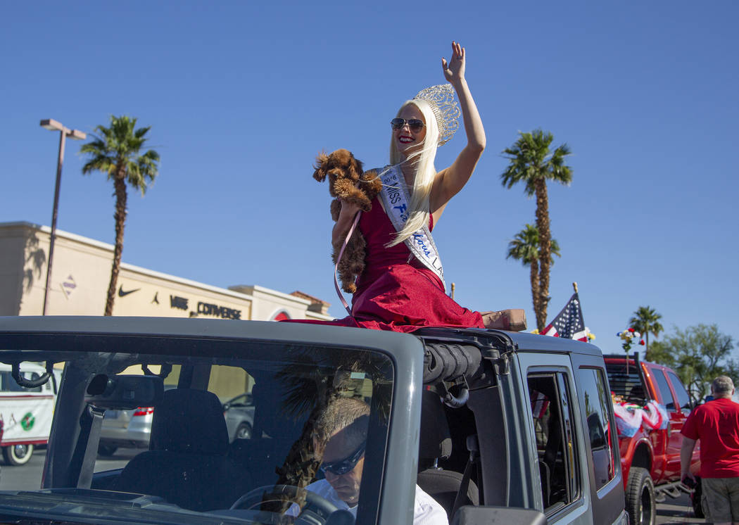 Kendra Daniels, 29, from Boston, waves before the parade during the fourth annual celebration o ...