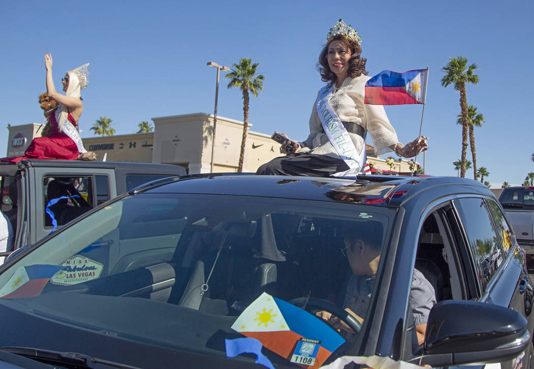 Ellen Stokes, right, from the Philippines, and Kendra Daniels, 29, left, from Boston, wait for ...