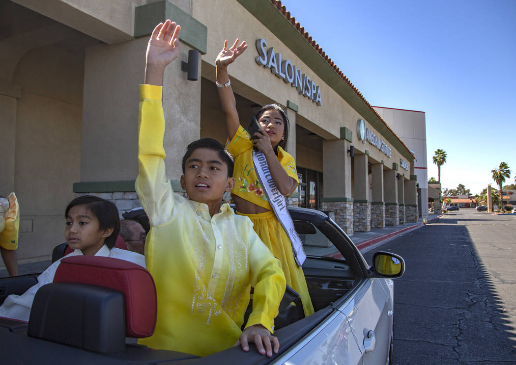 Siblings Sophia Natividad, 9, right, and Maverick Santos, 11, middle, and Joseph Natividad, 6, ...