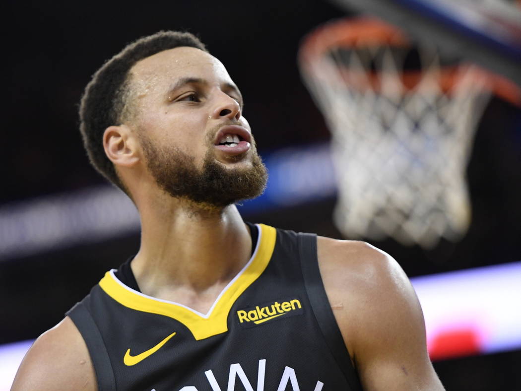 Golden State Warriors guard Stephen Curry reacts during the second half of Game 4 against the T ...