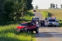 A damaged truck sits on the side of the road after an accident involving a horse-drawn carriage ...