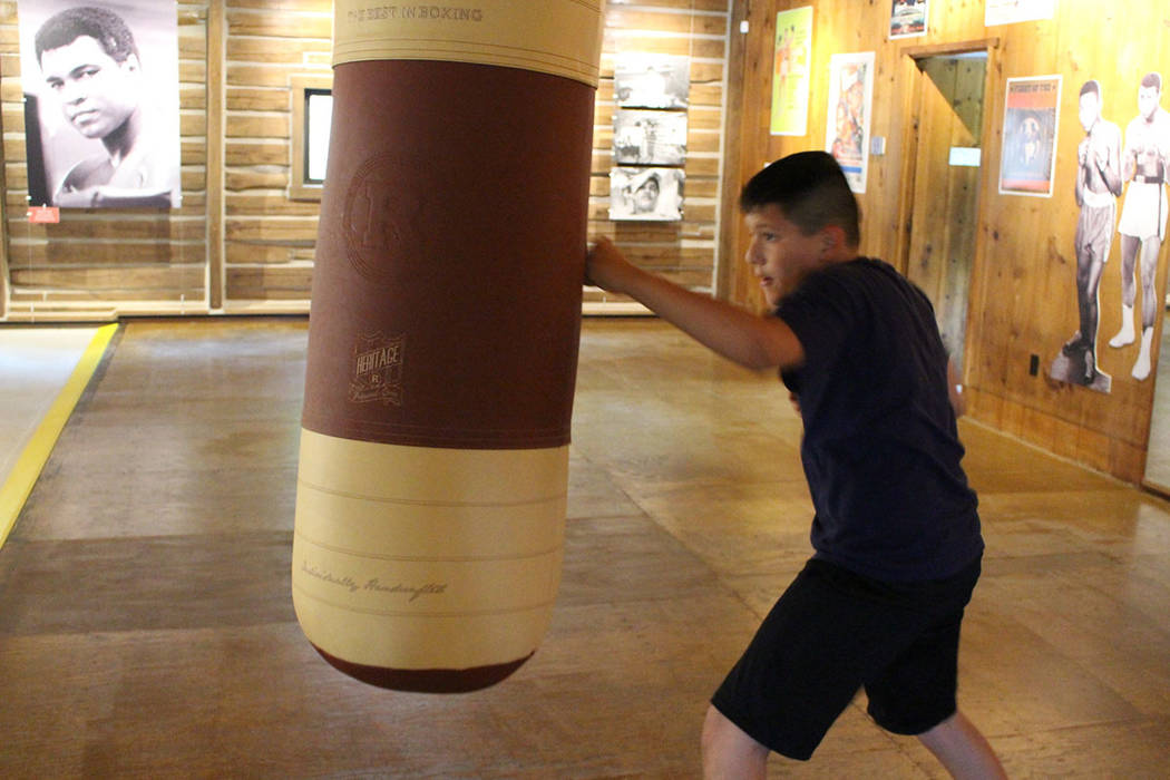 Benny Quiles-Rosa punches the heavy bag in the gym at Fighter’s Heaven, Muhammad Ali&#x2 ...