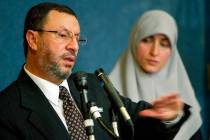 In this Feb. 16, 2004 file photo, Abdelhaleem Ashqar, left, with his wife Asma, right, meets r ...