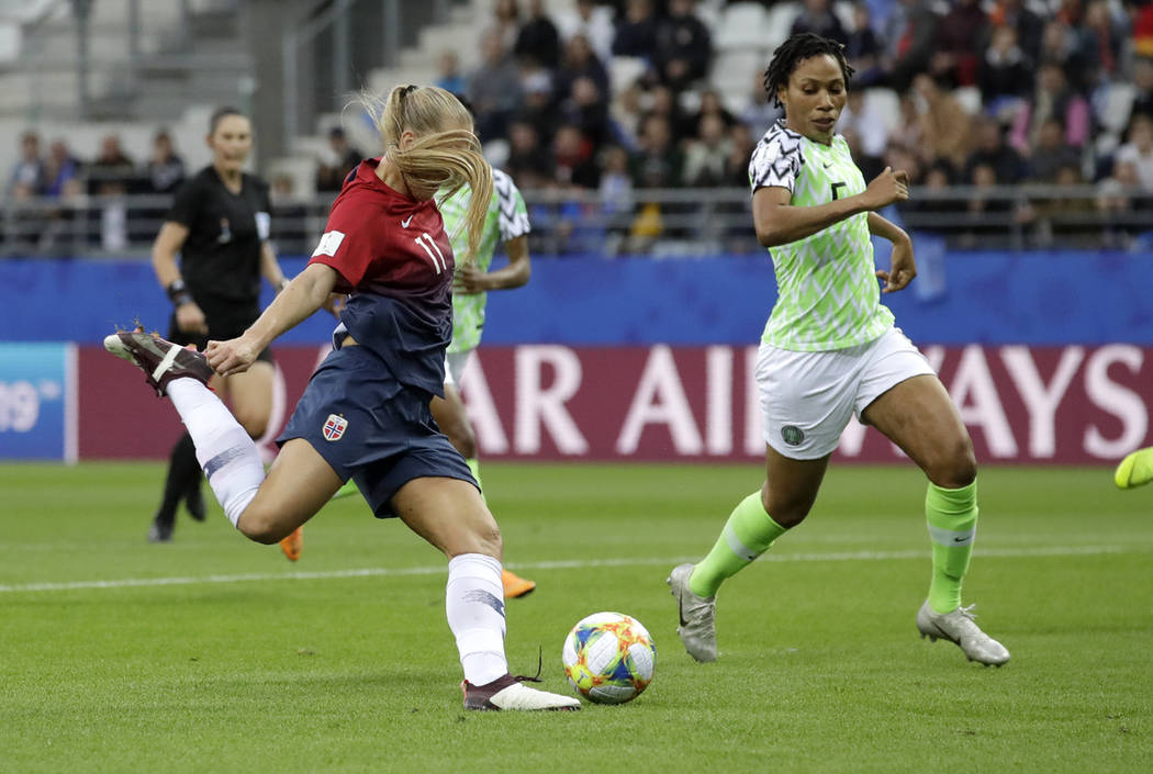 Norway's Lisa-Marie Utland, left, kicks the ball past Nigeria's Onome Ebi to score her team's s ...