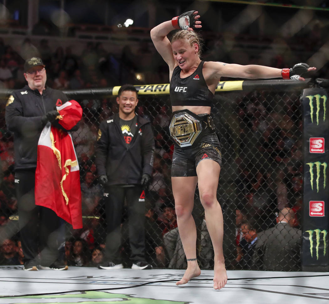 Valentina Shevchenko celebrates after defeating Jessica Eye during their women's flyweight titl ...