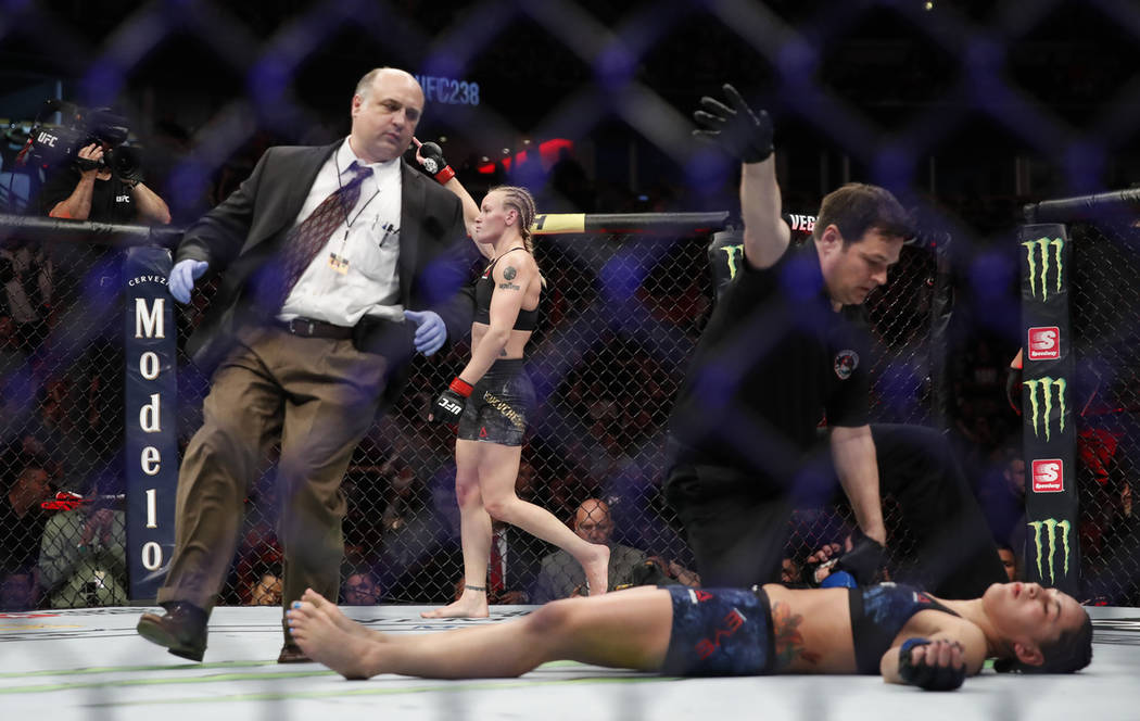 Valentina Shevchenko, rear, celebrates after knocking out Jessica Eye during their women's flyw ...