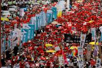 Protesters march along a downtown street against the proposed amendments to an extradition law ...