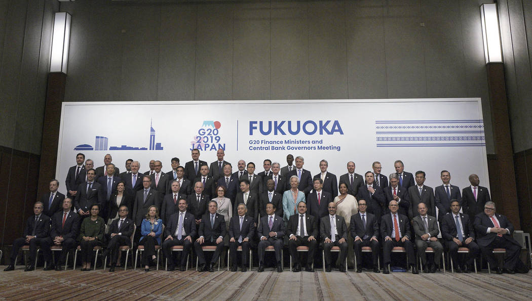 Japan's Finance Minister Taro Aso, center right in front, and Bank of Japan Governor Haruhiko K ...