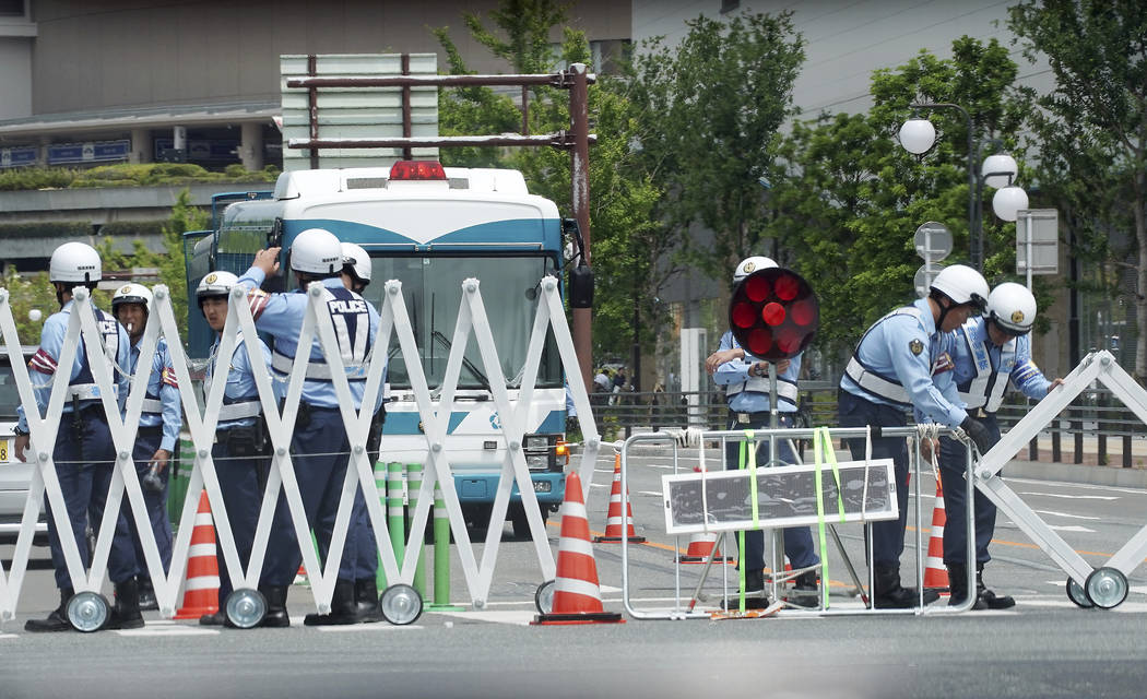 Police officers control traffic near the venue of G20 Finance Ministers and Central Bank Govern ...