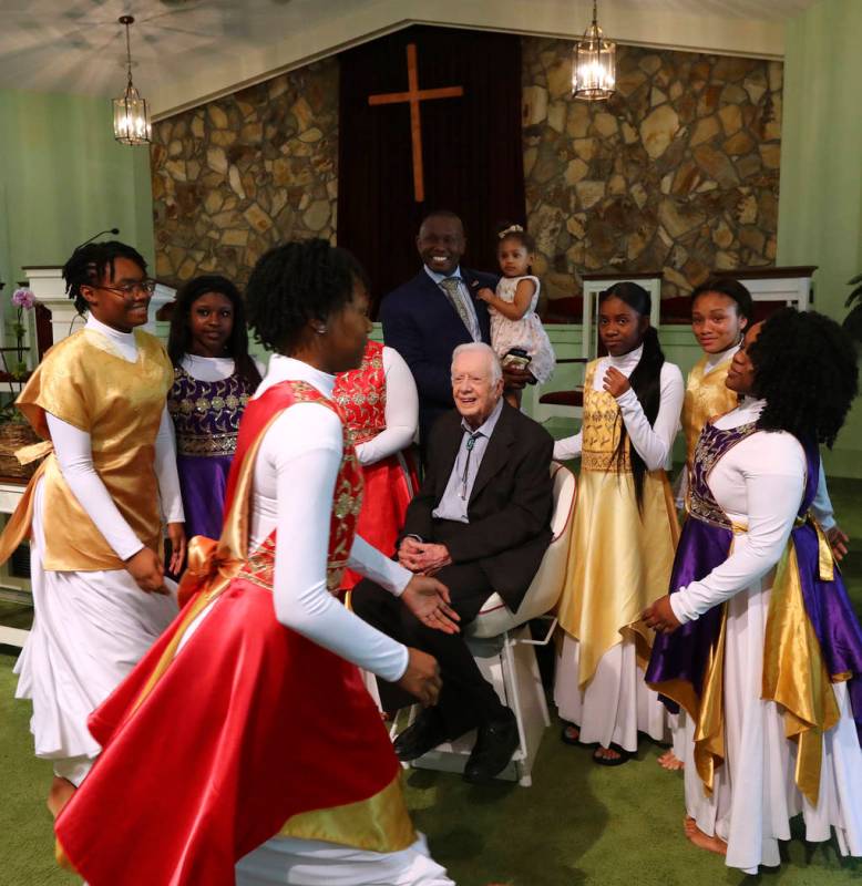 President Jimmy Carter has his picture taken with the Hayiya Dance Theatre, Inc. after they per ...