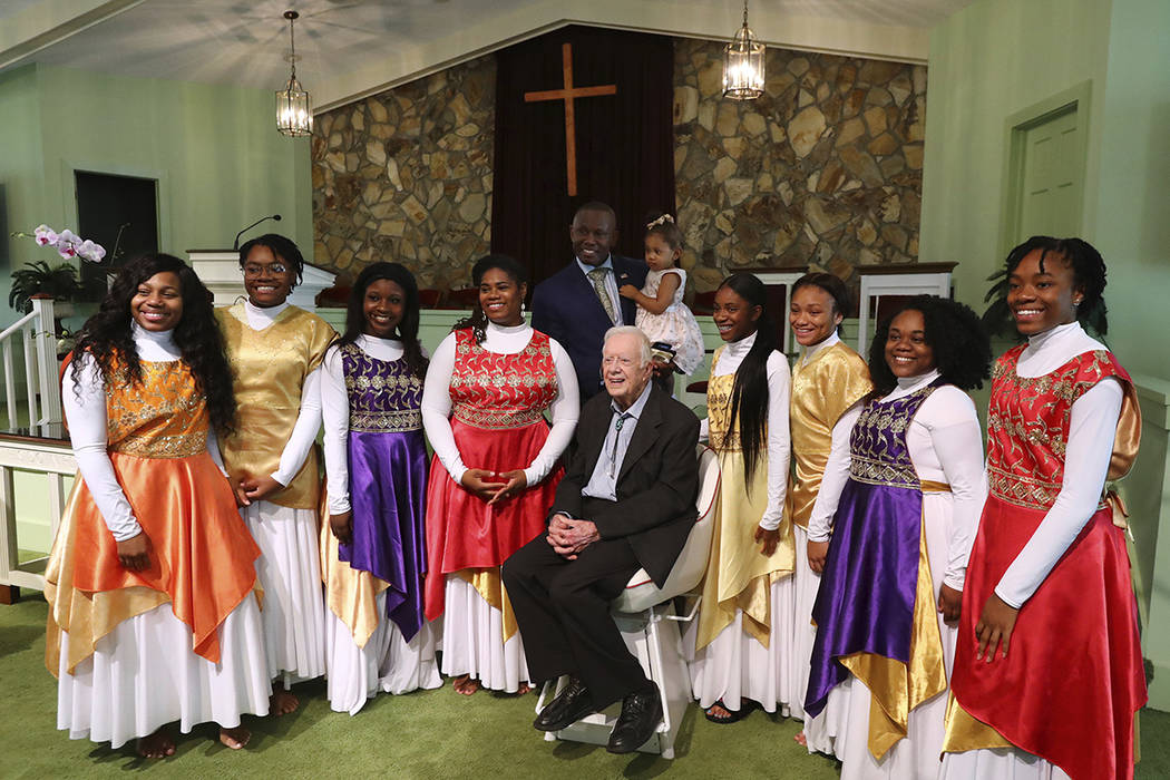 President Jimmy Carter has his picture taken with the Hayiya Dance Theatre, Inc. after they per ...