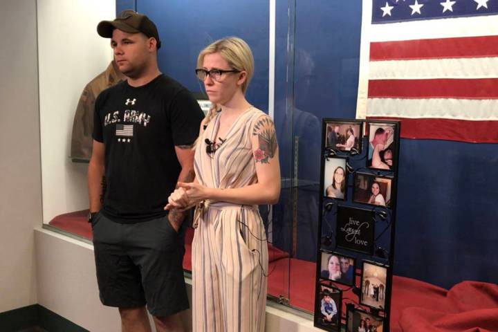 Joshua Boothe and Shaylea Gallagher stand next to family photos Sunday, June 9 at the Nevada Ar ...