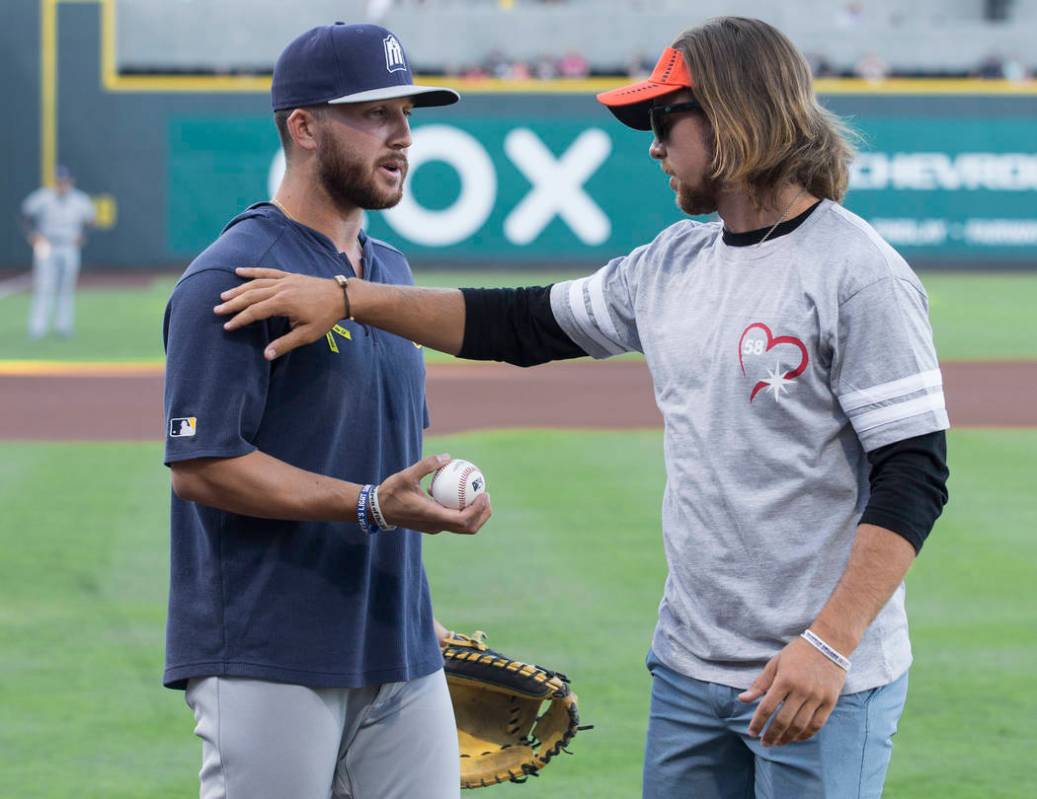 Kaden Manczuk, right, greets San Antonio Missions pitcher Bubba Derby after Manczuk threw out t ...