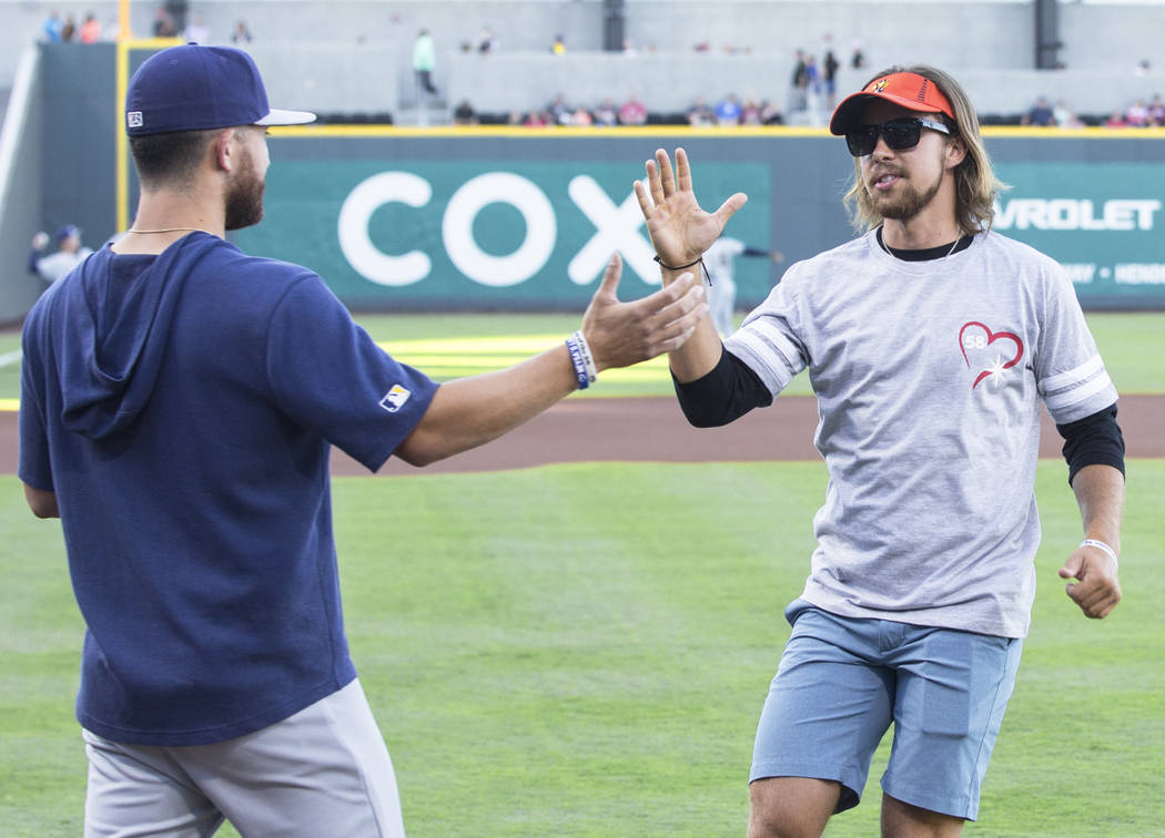 Kaden Manczuk, right, greets San Antonio Missions pitcher Bubba Derby after Manczuk threw out t ...