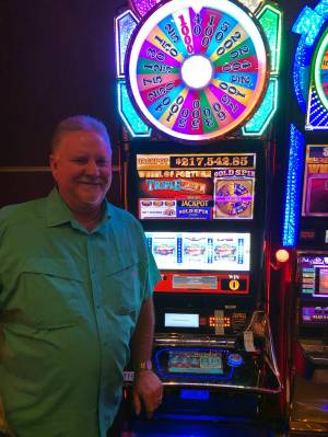 Ronnie Burnett of Midland, Texas, won $217,542.85 on the Wheel of Fortune machine at the Golden ...