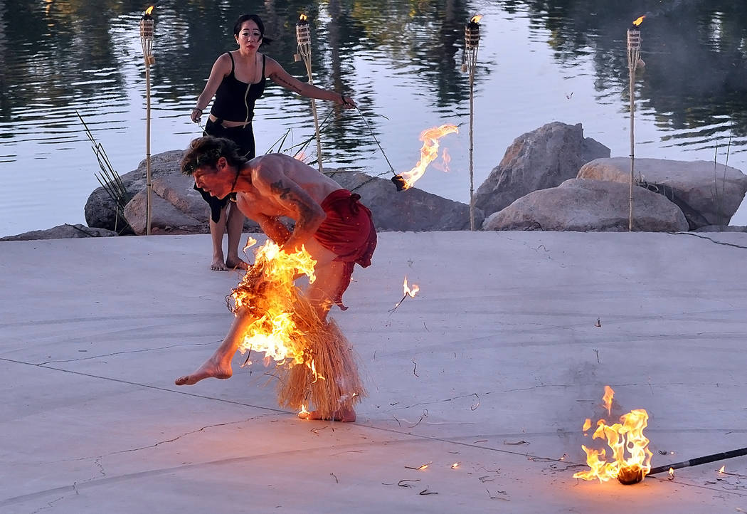 A fire dancer's costume catches fire while performing at a luau outside the Lakeside casino in ...