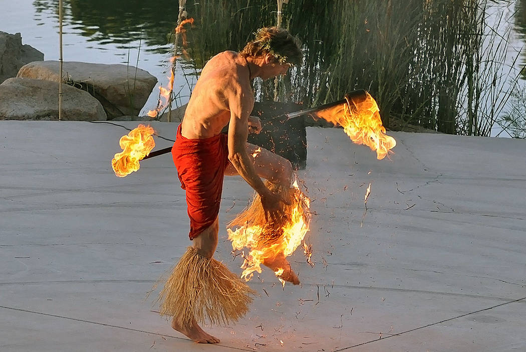 A fire dancer's costume catches fire while performing at a luau outside the Lakeside casino in ...