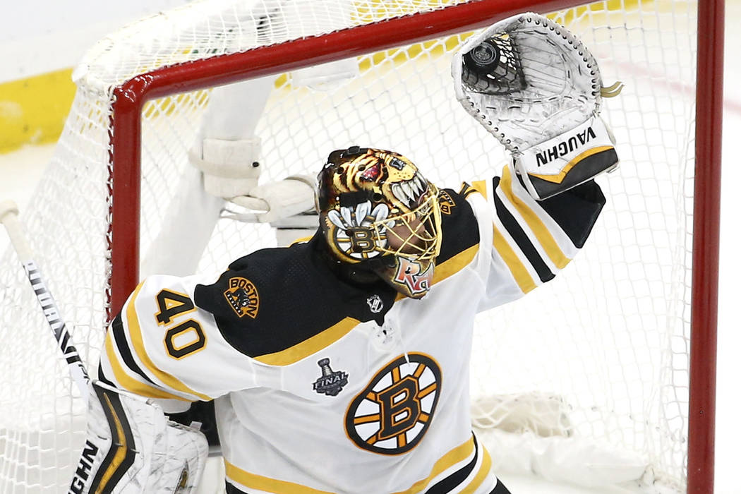 Boston Bruins goaltender Tuukka Rask, of Finland, gloves a shot against the St. Louis Blues dur ...