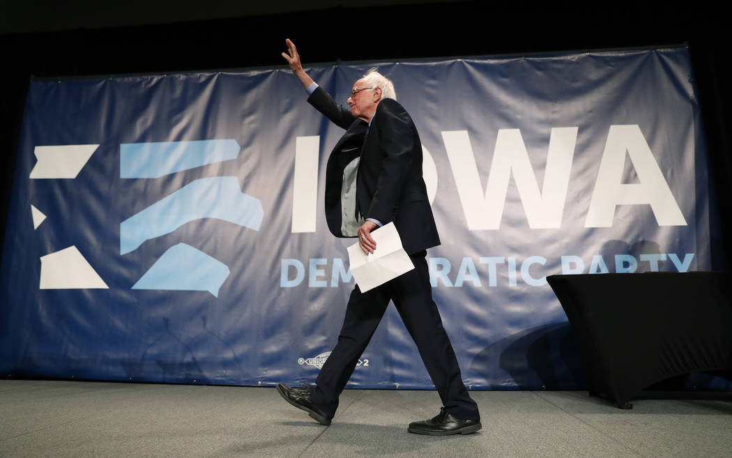 Democratic presidential candidate Bernie Sanders arrives on stage to speak during the Iowa Demo ...