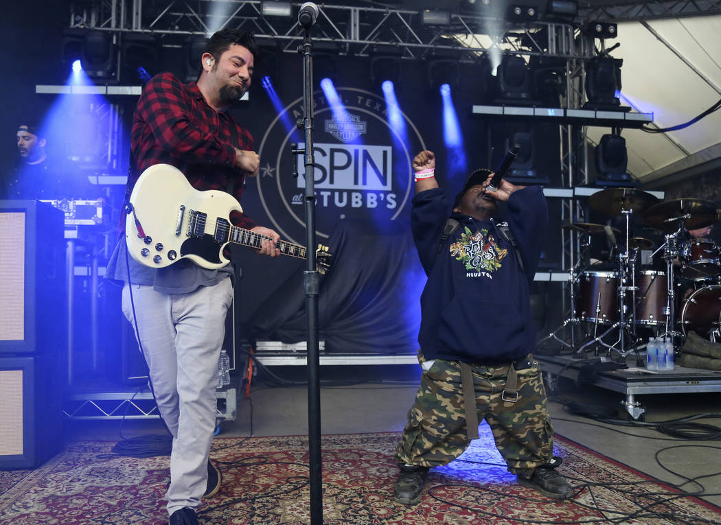 FILE - In this March 18, 2016, photo Bushwick Bill, right, joins Deftones' Chino Moreno onstage ...