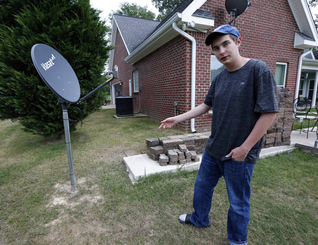 In this May 8, 2019, photo, Riley Shaw talks about his family's internet at his home outside St ...