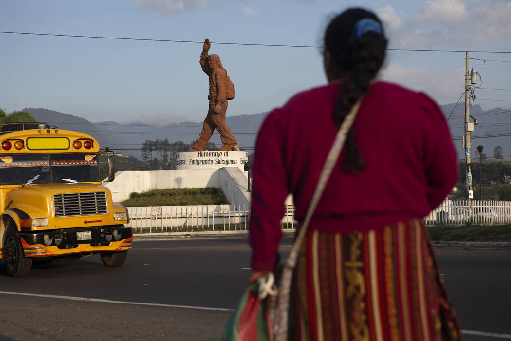 In this June 7, 2019, photo, a Quiche indigenous woman stands facing a monument that pays homag ...