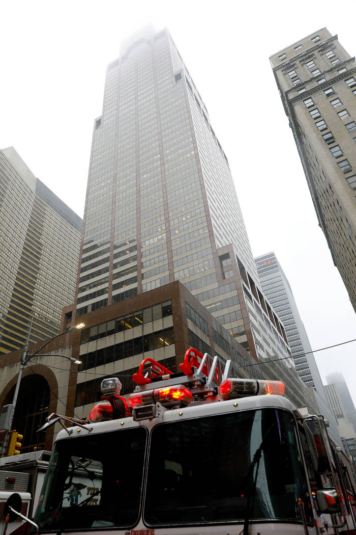 New York firefighters respond to the scene where a helicopter was reported to have crash landed ...